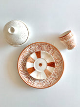 Load image into Gallery viewer, Terracotta color Moroccan zwak design handmade hand painted ceramic plate on table with butter dish and tea cup